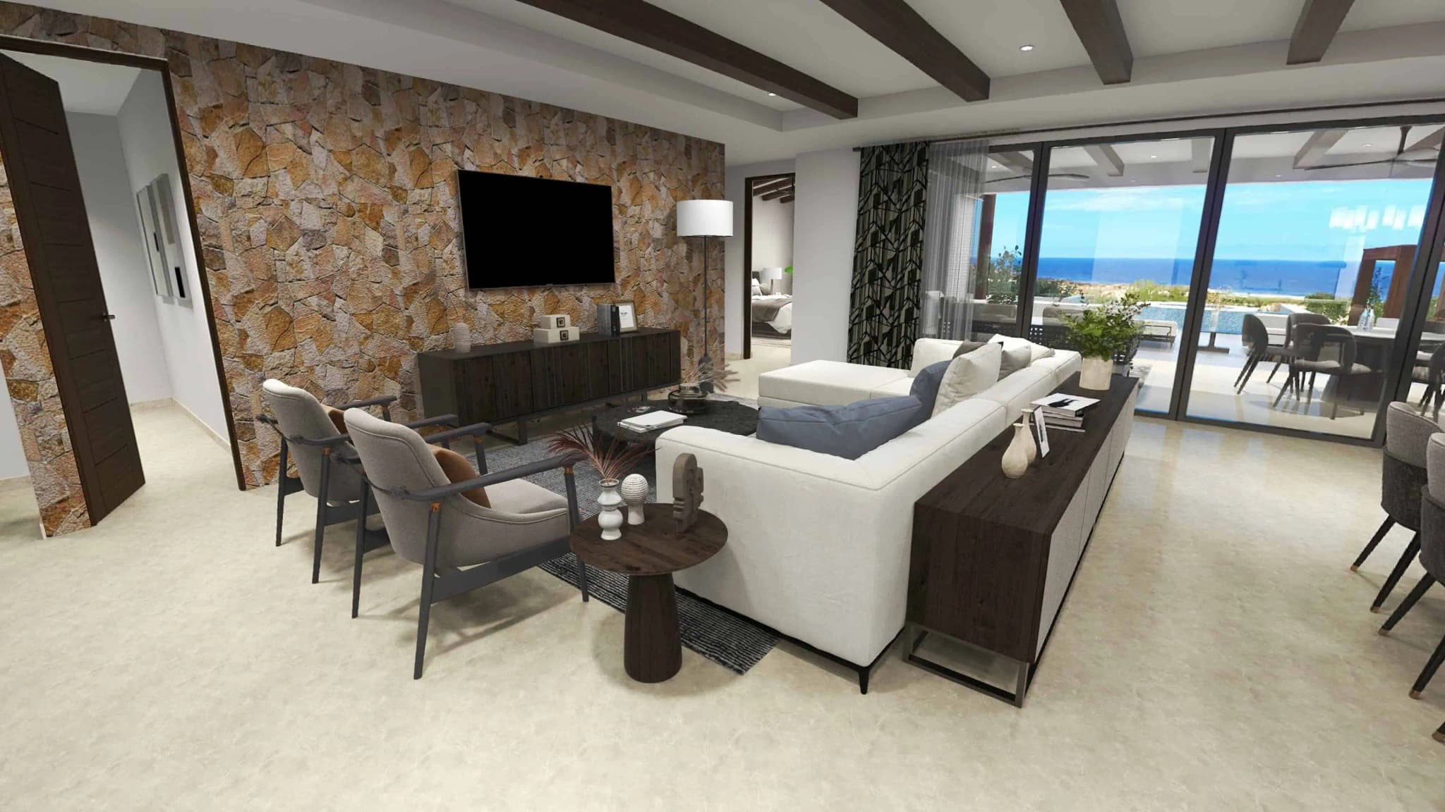 Living room with stone accent wall and ocean view in the Luna model at Coronado development